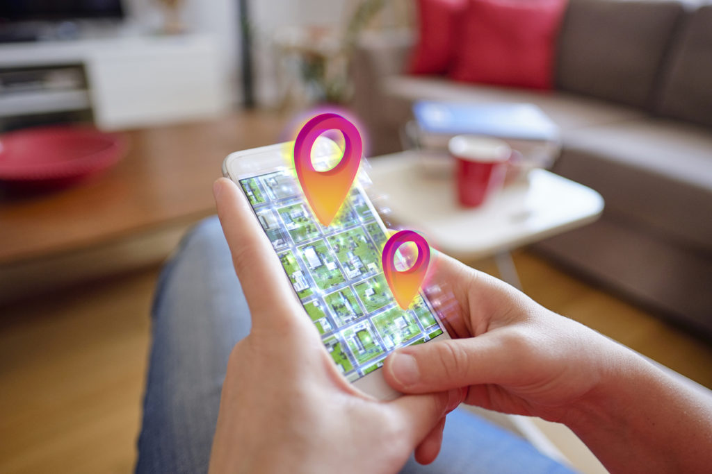 holding phone with interactive maps and virtual tours
